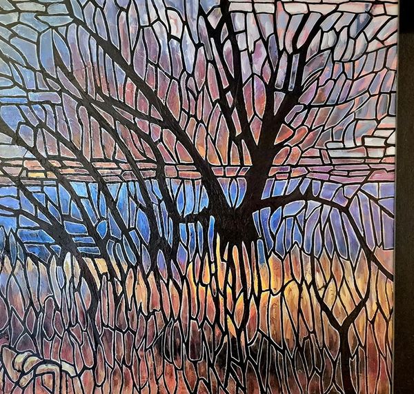 Abstract stained-glass tree with sunset colors.