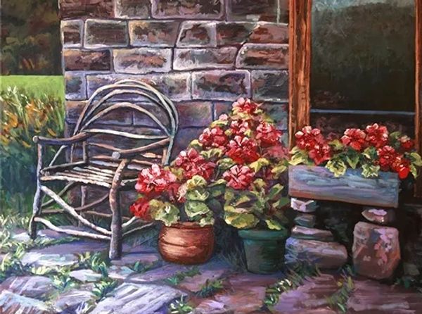 Rustic porch with wooden chair and vibrant potted flowers beside stone wall.
