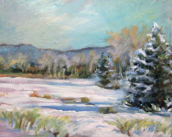 Snow-covered landscape with evergreen trees under a pale sky.