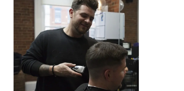 Jordan Ryan at the Vagabond Barber in Oceanport NJ giving a haircut
