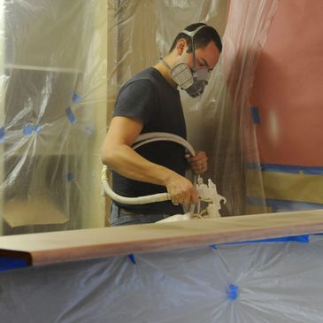 Professional masking of kitchen cabinets and walls to protect against moisture and overspray