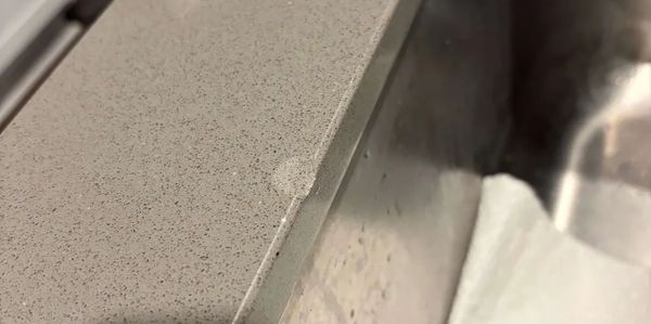 Before Seamless granite chip repair. Expert stone restoration in Covington and Seattle.