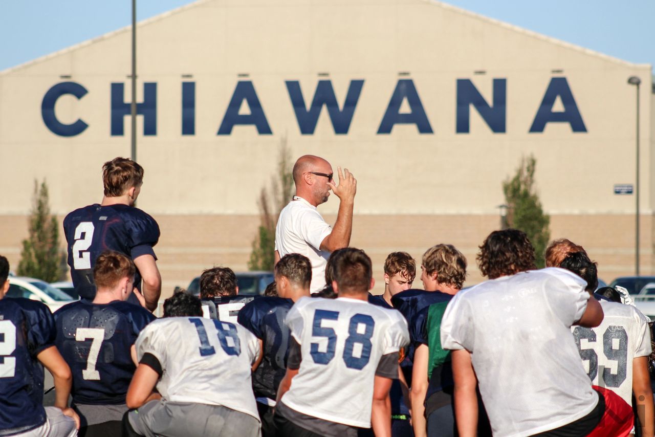 Head Coach Scott Bond speaking to team after morning practice (Photo Credit: Jamie Council)