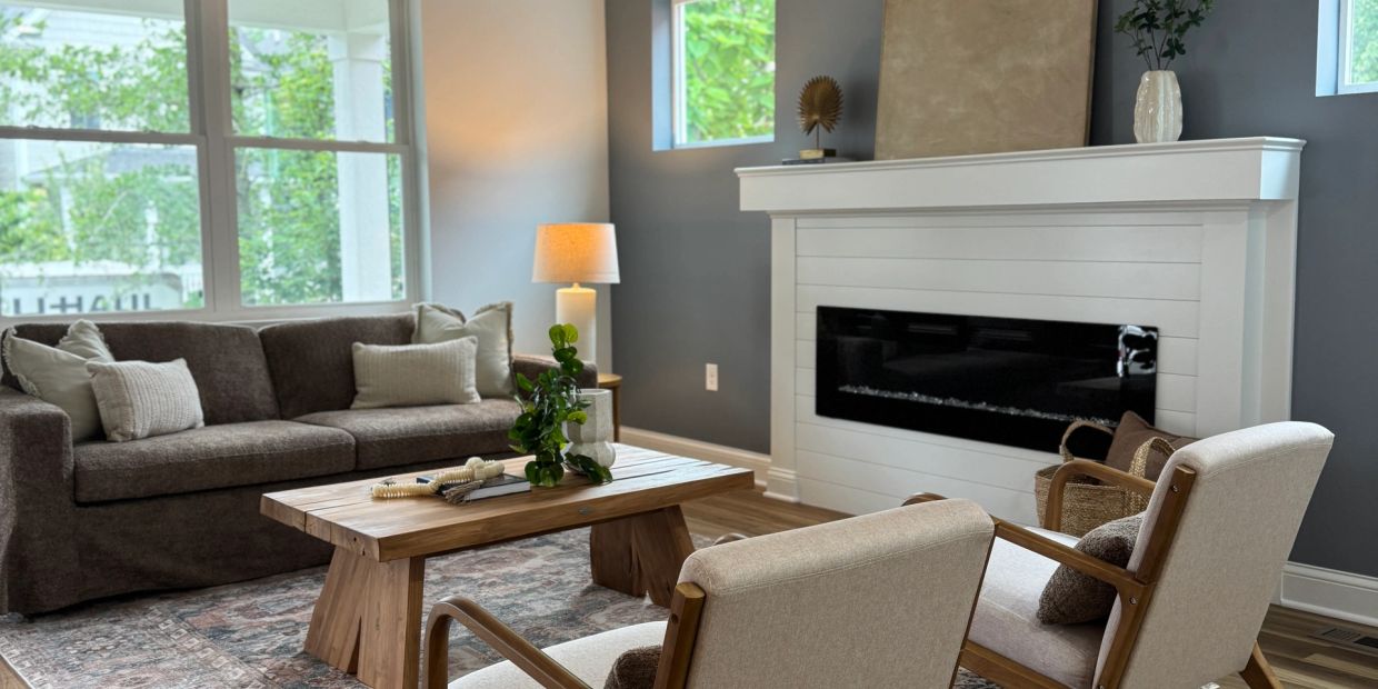 Cozy living room with neutral tones and natural light.