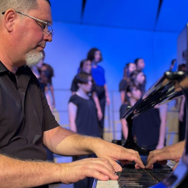 David Mount accompanying at the piano
