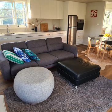 Cottage interior with modern kitchen at The Gallery Farm Mid North Coast NSW