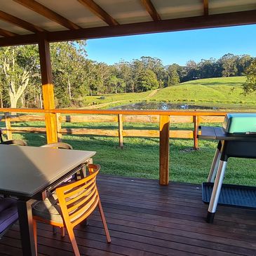 Deck with BBQ and paddock views at The Gallery Farm Mid North Coast NSW