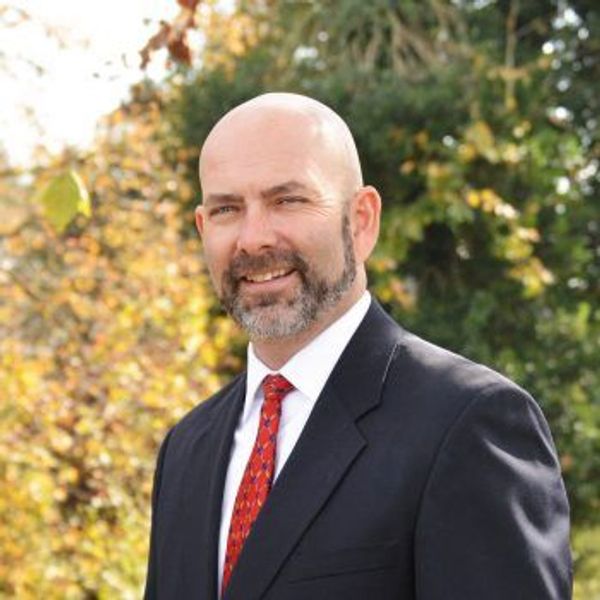 Image of a person outside smiling