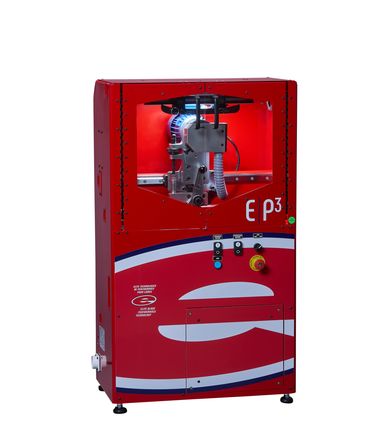 Red industrial machine with control buttons and a visible internal mechanism.