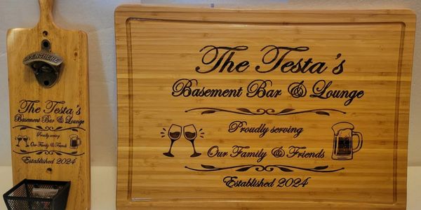 Wooden bar tools engraved with "The Testa's Basement Bar & Lounge" and family-friendly message.
