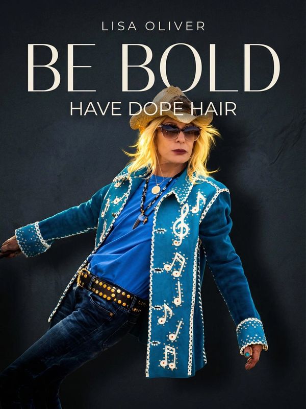 A bold woman in a blue musical-themed jacket and straw hat poses confidently.