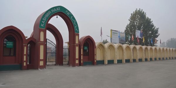 Entrance gate of Kashmir Haat with ticket booths.