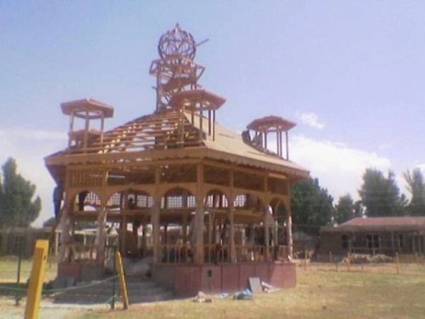 An unfinished wooden pavilion structure under construction.