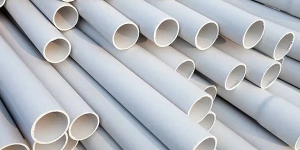 Stack of white PVC pipe.