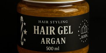 A jar of golden hair gel with a black label and gold lid.
