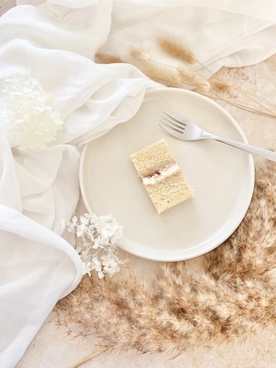 Vanilla bean wedding cake sponge with raspberry conserve and vanilla bean buttercream on plate 