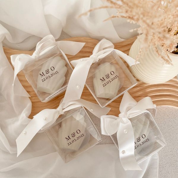 Elegant and chic Madeleine edible wedding favours, presented in a clear box, satin bow and pearls