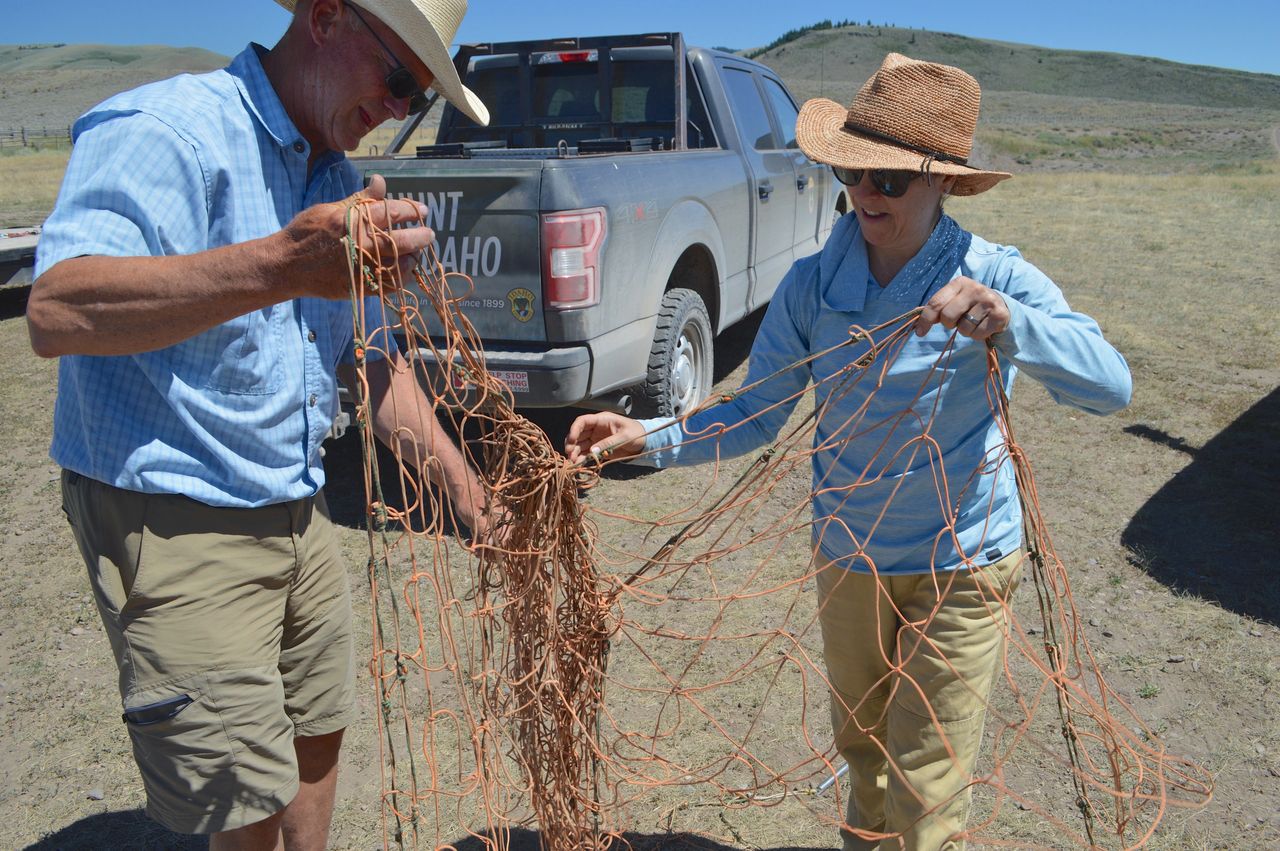 Mark Harbaugh (left), HFWA board member, and Meghan Wolf, Patagonia, assist with nets | Josh Rydalch