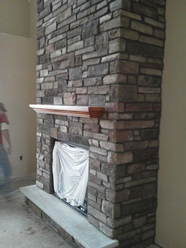 Stone veneer fireplace 