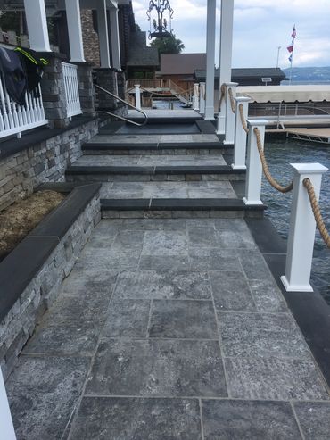 Walkway into steps capped with stone, stone boarders and treads 