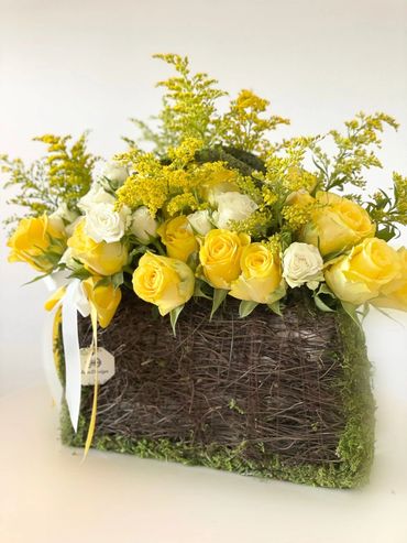 yellow roses in a bag