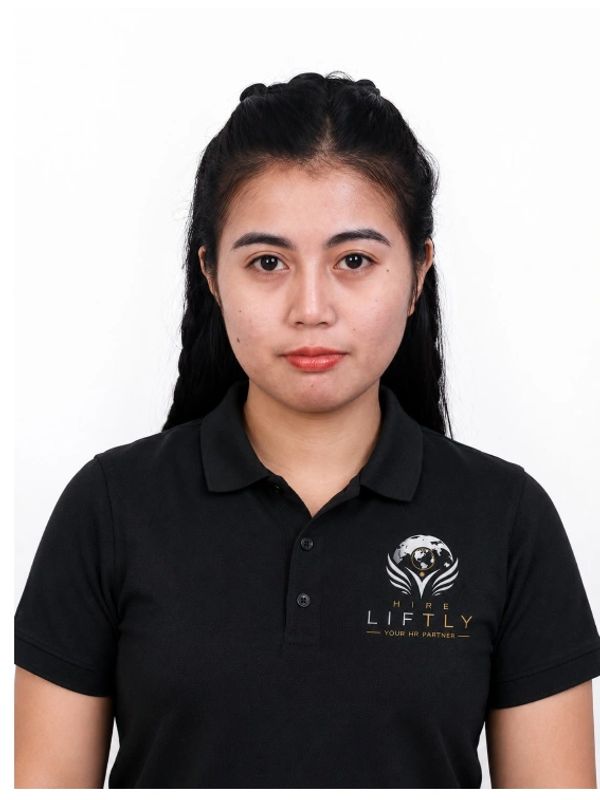 Portrait of a woman in a black LIFTLY polo shirt.
