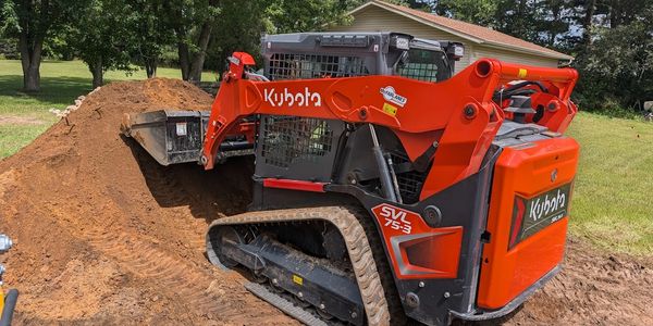 Professional landscaping equipment used for site preparation and landscape installation