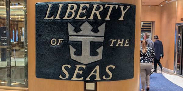 A placard displaying the Royal Caribbean logo and the Liberty of the Seas ship name 