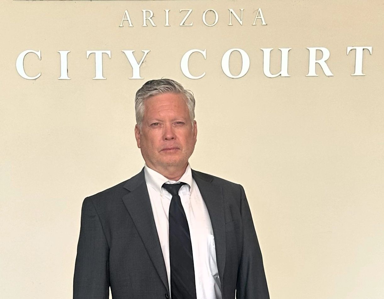 Scottsdale DUI Lawyer, Dave Smith, standing in front of the Surprise City Court sign.