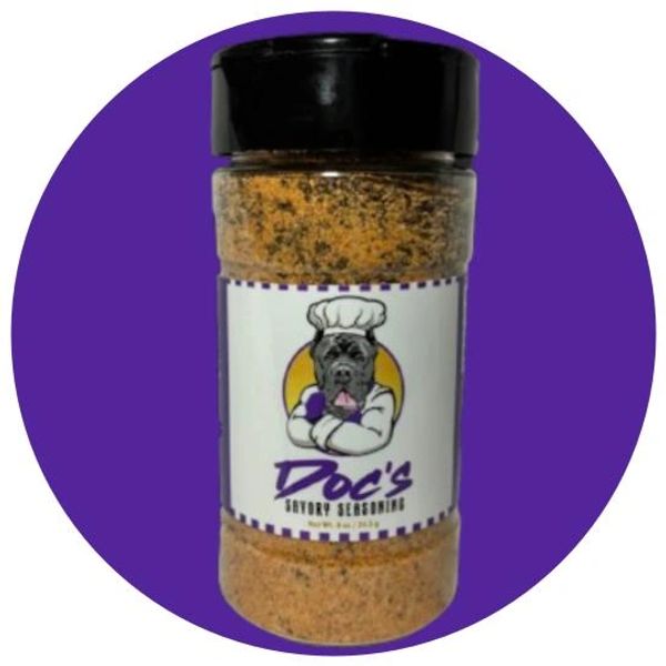 A seasoning bottle labeled 'Doc's Savory Seasoning' with a dog chef logo.