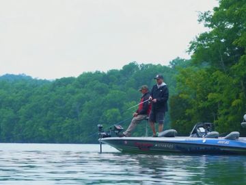 Bobby Gentry and his guest on a boat fishing on Dale Hollow Lake