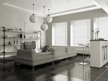 Three white wooden venetian blinds in a kitchen diner.