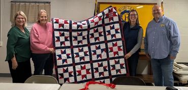 Donated quilt from the Berea Library Quilting Group for the Grand Marshall of the Stem Holiday Parad