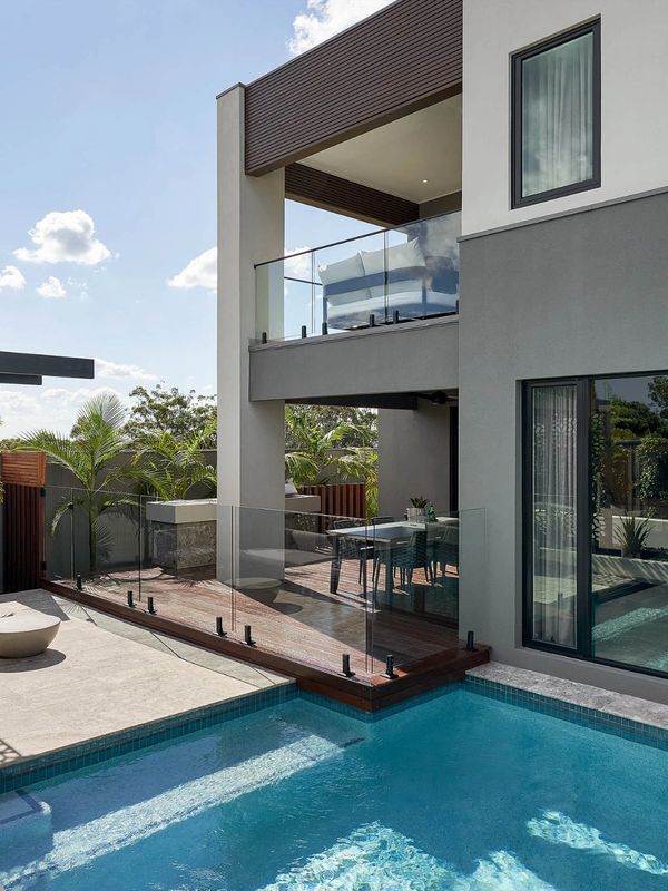 New home with windows and swimming pool