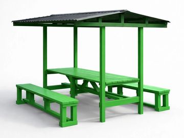 Green outdoor picnic table with benches and a roof.