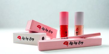 Lip by Evy branded lip gloss and packaging in pink and red colors.