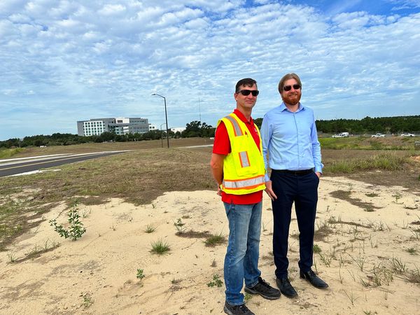 Brad & Tyler at the ribbon cutting ceremony opening the new stretch of Harmon Road leading to Advent