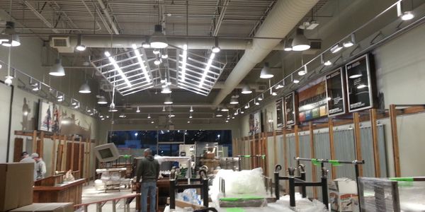 Industrial workshop with high ceilings and various equipment.
