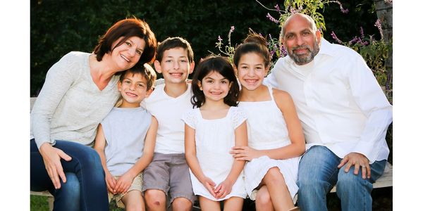 JOHN AND MARIANNA FOVOS FAMILY PHOTO WITH THEIR FOUR KIDS