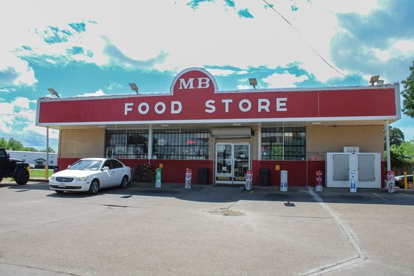 A storefront with the sign reading "MB Food Store"