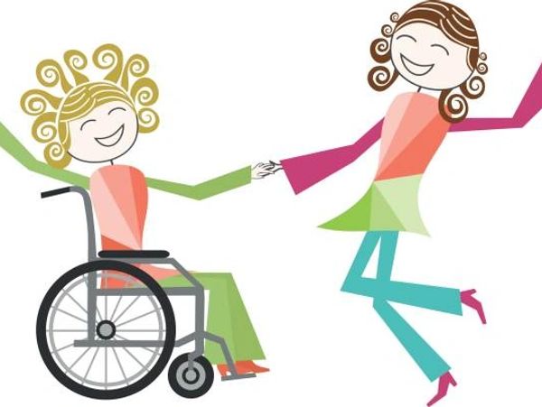 Two joyful women holding hands, one in a wheelchair, the other dancing.