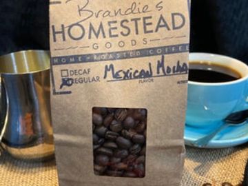 Bag of Mexican Mocha coffee beans with a cup of coffee.
