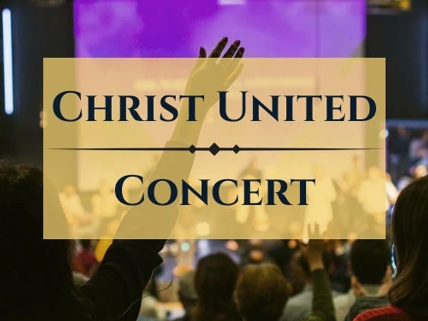 Audience raising hands in worship at Christ United Concert.