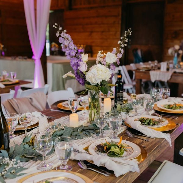 Wedding table setting in barn