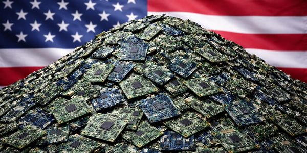Pile of computer chips with an American flag background.