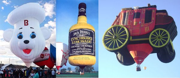 Three hot air balloons shaped like a chef bear, a Jack Daniel's bottle, and a stagecoach.