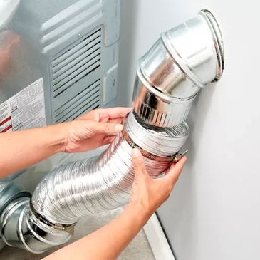 service technician installing dryer hose to dryer duct