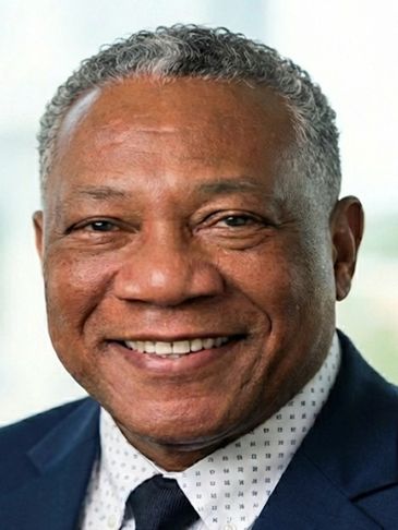 Smiling mature man in a suit and tie.
