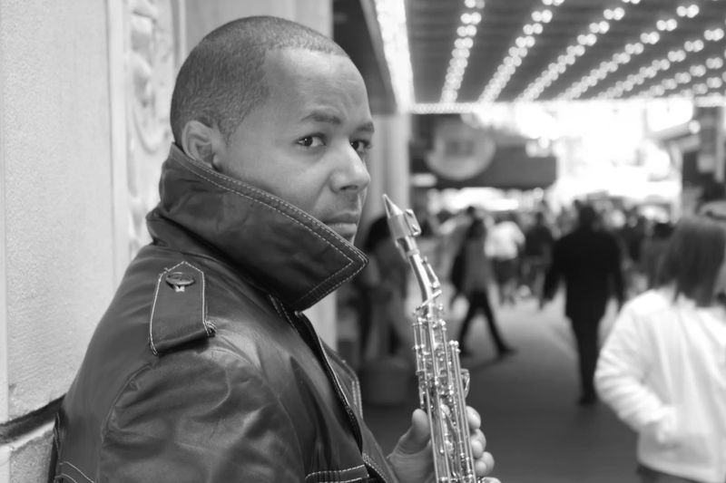 Najee Leather Jacket and Sax Photo.png