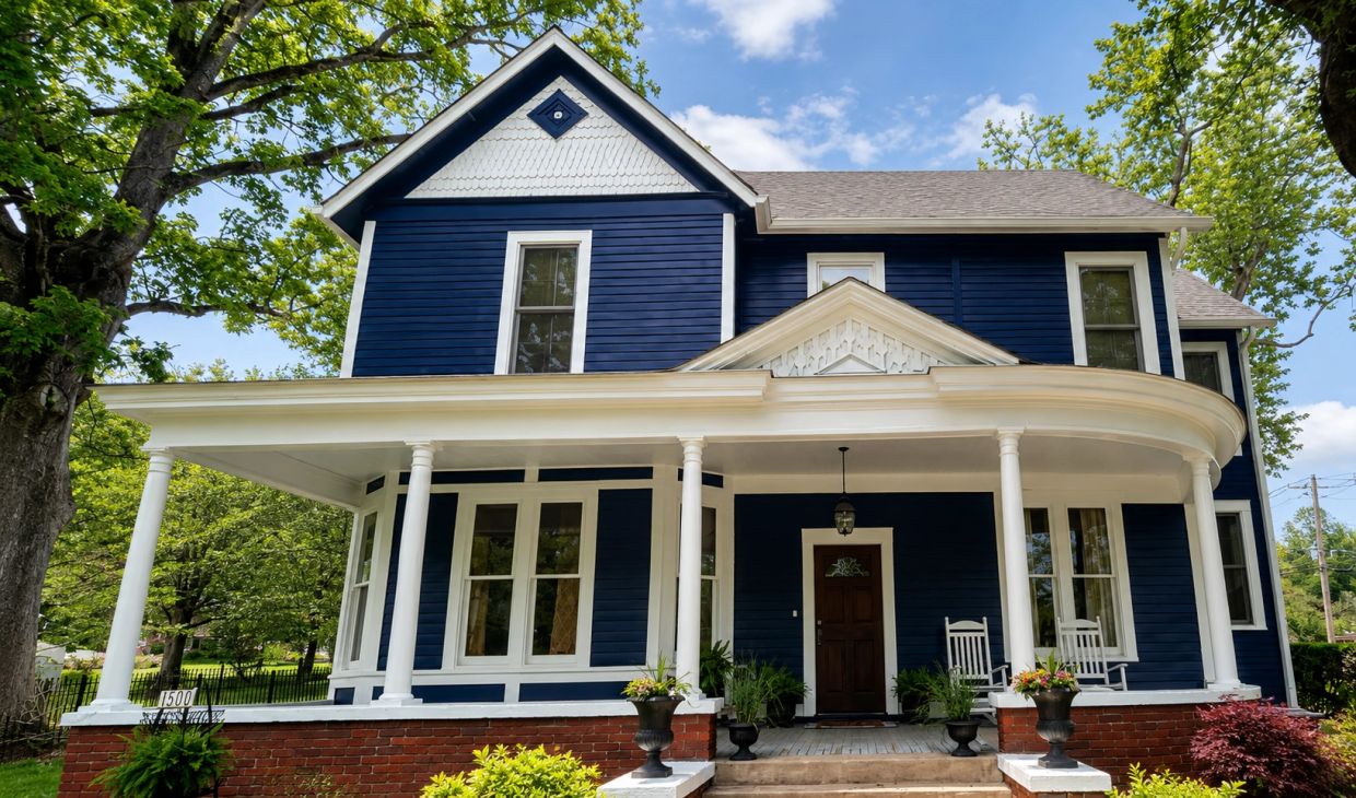 Blue Victorian house with white trim and columns. Cleveland, TN.